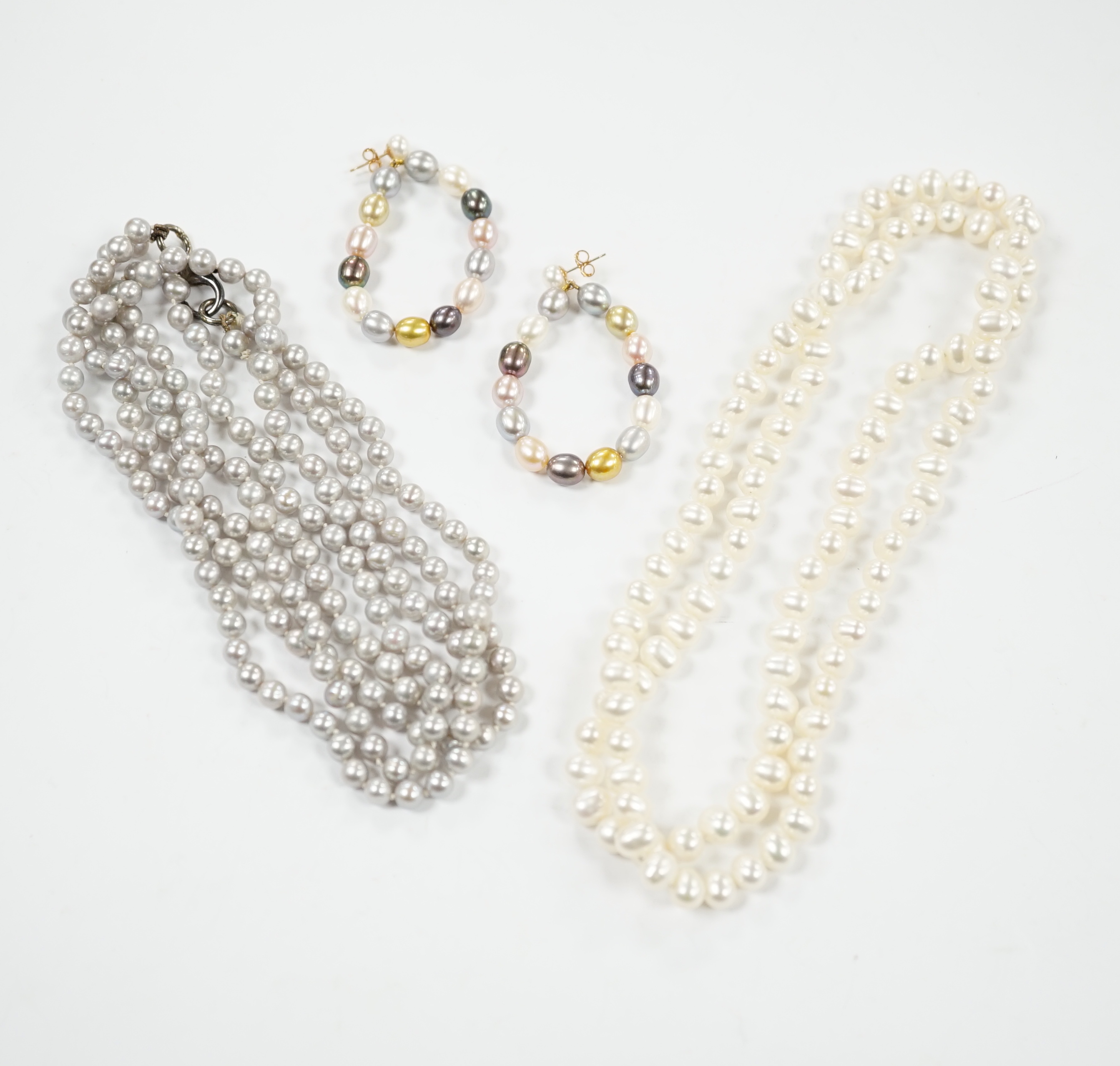Two freshwater pearl necklaces including double strand, 56cm and a pair of 9ct and multi coloured freshwater pearl earrings.